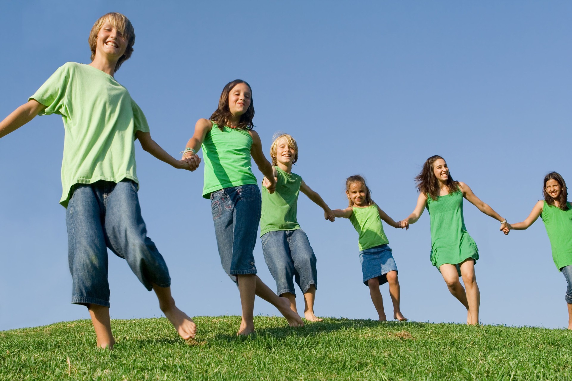 group of happy smiling kids at summer camp