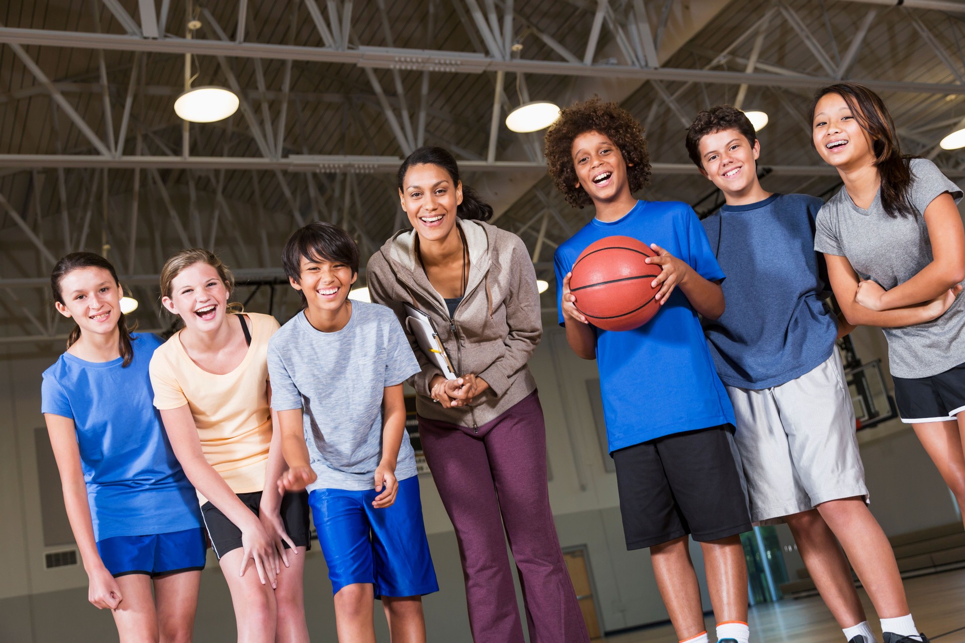 Group of children with basketball coach